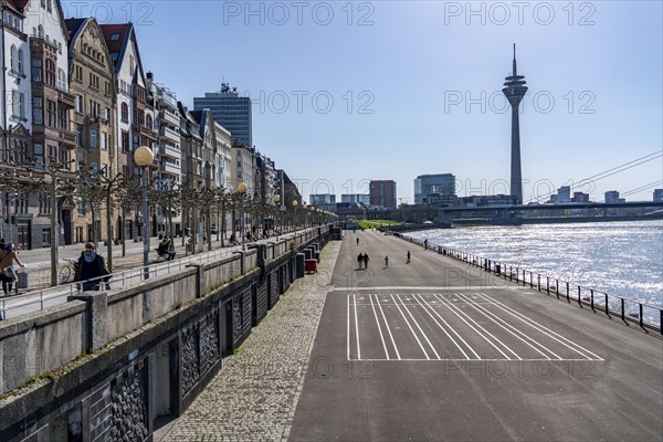 Empty Rhine embankment promenade, consequences of the contact ban, effects of the coronavirus