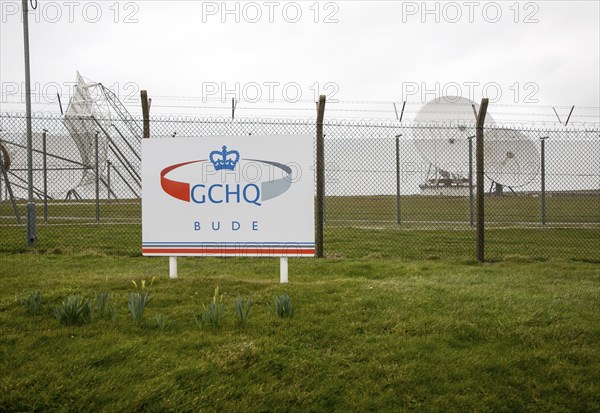 Satellite receiver dishes and sign for GCHQ facility near Bude, Cornwall