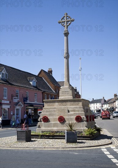 War memorial and historic buildings in the town of Holt, north Norfolk, England, United Kingdom,