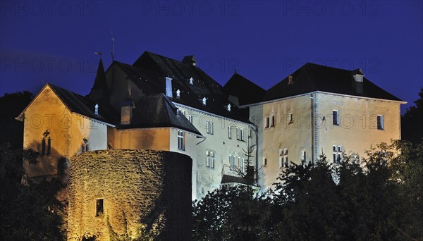 The Bourglinster Castle illuminated at night, Luxembourg, Europe
