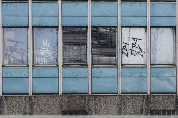 Broken windows and shutters of an abandoned office building loom in Berlin, 29/02/2024