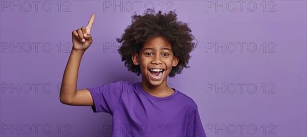 Young attractive black male pointing finger at copy space. Promo and advertisement discount