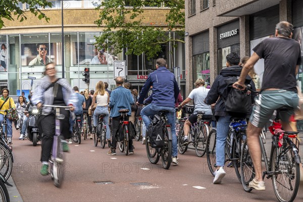 Central cycle path on Lange Viestraat, in the city centre of Utrecht, lanes for pedestrians,