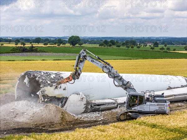 Demolished tower of a 20 year old wind turbine, in the Werl wind farm, 5 old Enercon E-66 turbines