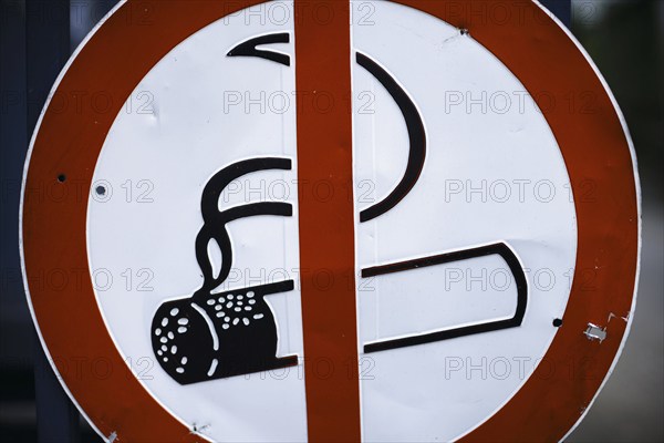 Symbolic photo on the subject of the smoking ban. Prohibition sign with a crossed-out burning