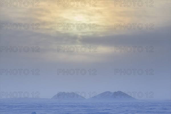 Pingo, mound, permafrost, Arctic, cold, snow, clouds, near Tuktoyaktuk, Northwest Territories,