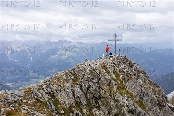 Aerial view, hiker on the Raudenspitze with summit cross, Carnic High Trail, Carnic Main Ridge,