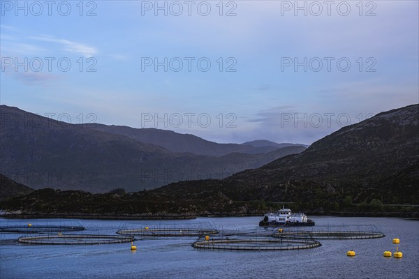 Sunset over Salmon farm in Norway, Innvikfjorden, Olden, Norway, Europe