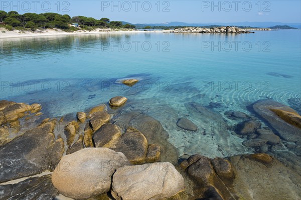 Quiet coast with turquoise water and rocky beach, Karidi beach, Karydi, Vourvourou, Sithonia,