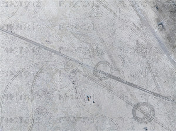 Tyre tracks in the salt pan, top-down, aerial view, Kubu Island, Botswana, Africa