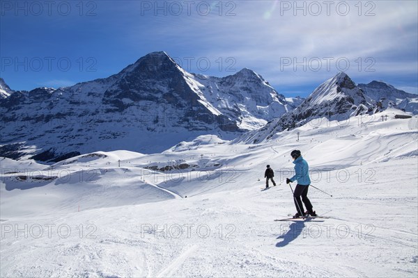 Skiing against the backdrop of the north face of the Eiger in Grindelwald, Switzerland, Europe