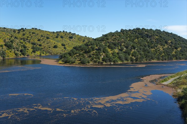 Expansive lake surrounded by wooded hills and clear skies, reservoir, Tagus River, Tagus River,