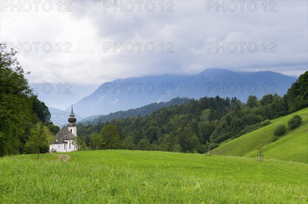 Maria Gern pilgrimage church, view of the Watzmann mountain shrouded in mist, Berchtesgarden Alps,