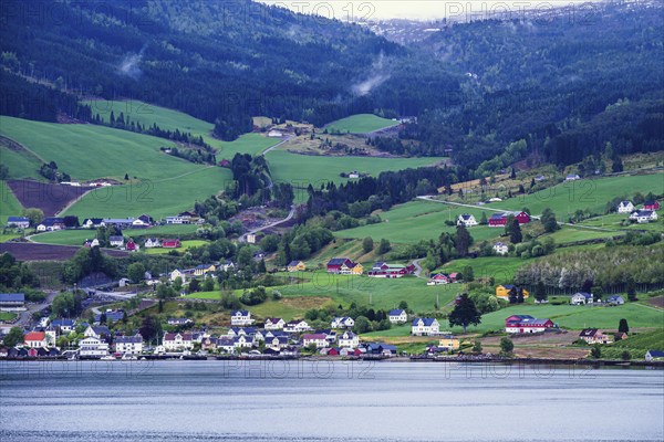 Mountains and Fiord over Norwegian Village in Olden, Innvikfjorden, Norway, Europe