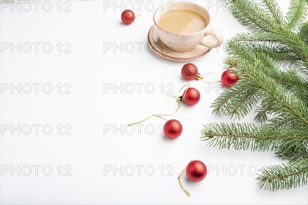 Christmas or New Year composition. Decorations, red balls, fir and spruce branches, cup of coffee,