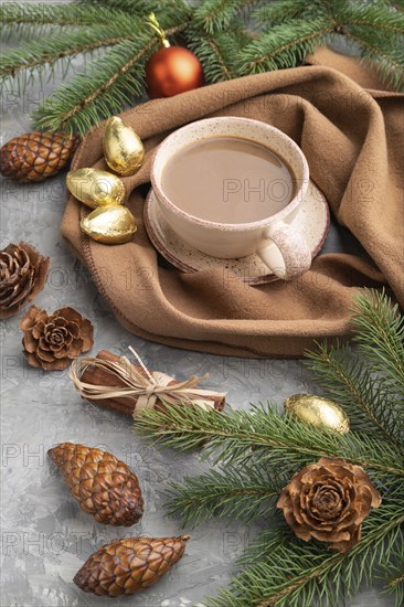 Christmas or New Year composition. Decorations, cones, cinnamon, fir and spruce branches, cup of