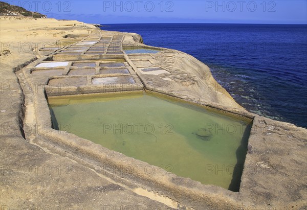 Historic ancient salt pans on coast near Marsalforn, island of Gozo, Malta, Europe