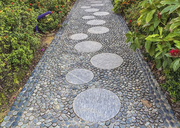 Decorative garden path of gray pebbles
