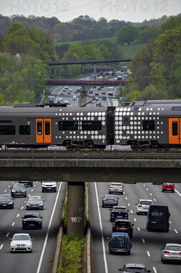 Rhine-Ruhr-Express, RRX train crossing the A3 motorway, traffic on 8 lanes, including the