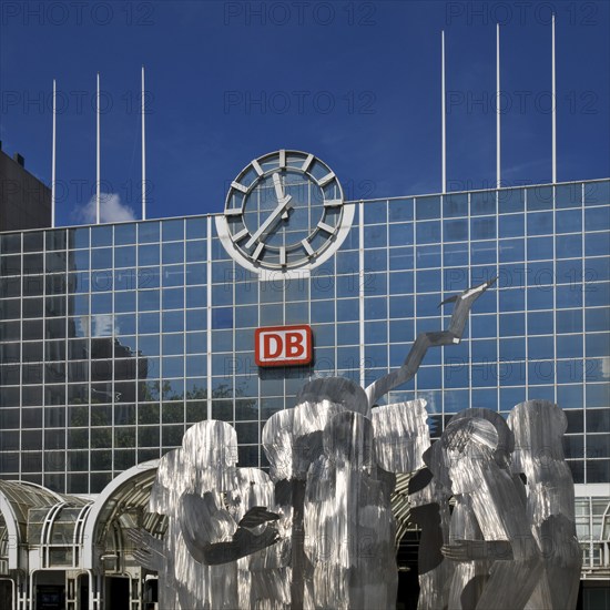A stainless steel figure group at the main railway station entitled The Ring by Horst Antes,