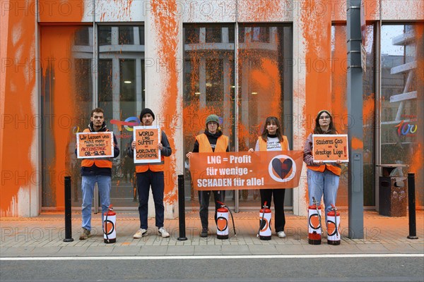 Last Generation activists after colour attack on Total Energies building. They are protesting