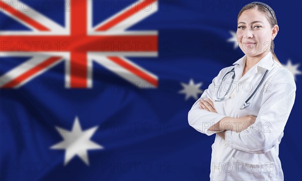 Female doctor on Australia flag. Doctor with crossed arms on Australian flag. Australian Health and