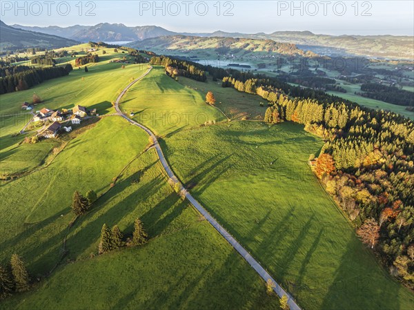 Mountain range near village Wertach, old farm, sunrise, fog in valley, traditional farm, autumn