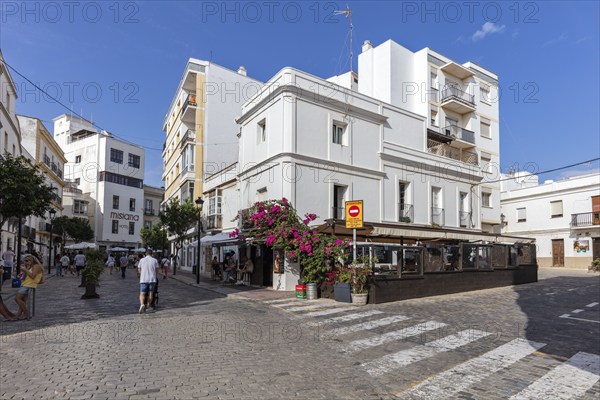 Living in a sunny town with white buildings and few people on the street, Tarifa
