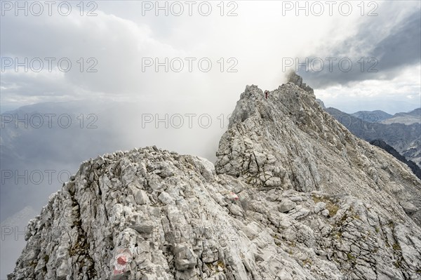 Clouds around a narrow rocky ridge, Watzmann crossing to Watzmann Mittelspitze, view of mountain