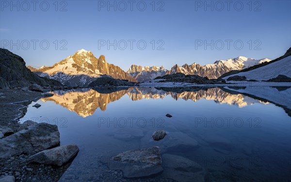 Evening mood, mountain landscape at sunset, alpenglow, water reflection in Lac Blanc, mountain