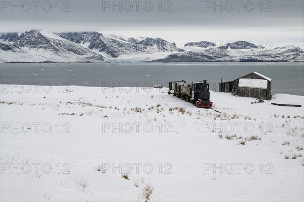 Historic mine railway in winter landscape, Kongsfjord, Ny-Ålesund, Spitsbergen Island, Svalbard and