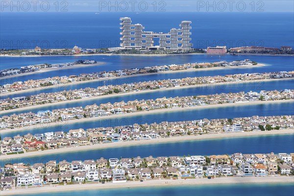 The Palm Jumeirah with Atlantis The Royal Hotel artificial island from above in Dubai, United Arab