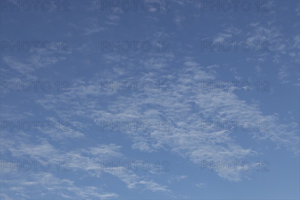 Altostratus white clouds in a blue sky, England, United Kingdom, Europe