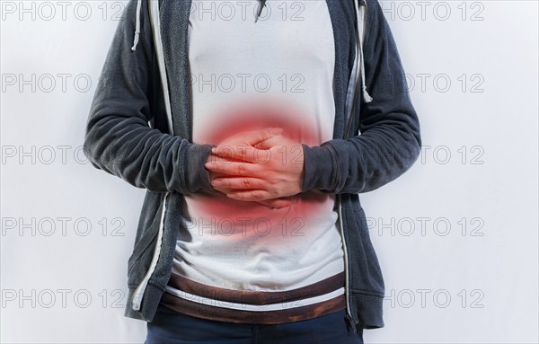 Person with digestive and stomach problems isolated. Unhappy man with digestive problems isolated