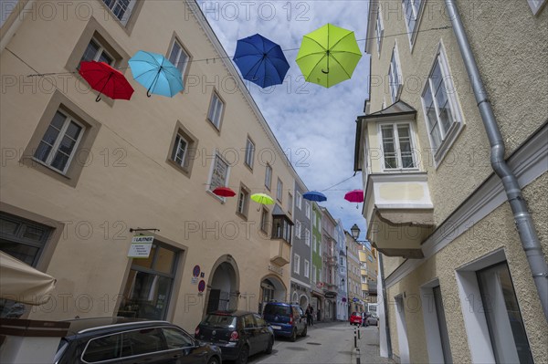 Colourful umbrellas stretched across the street, promising a prosperous and perfect life,