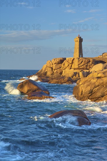 Lighthouse, Phare de Mean Ruz or Phare de Ploumanach, in the foreground rocky coastal landscape,