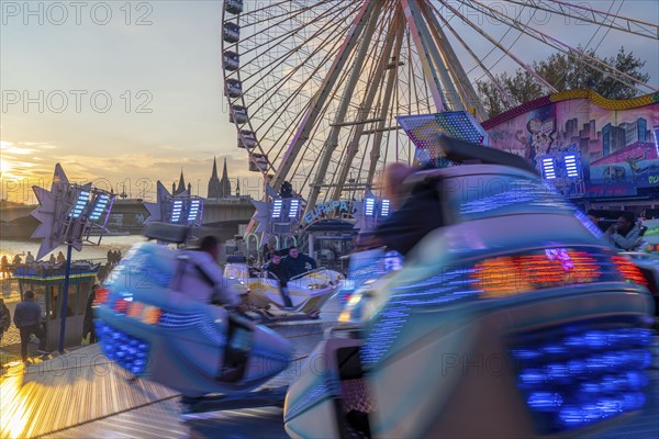 Deutz funfair on the Rhine, at Easter, funfair, break-dancer ride, Ferris wheel, Cologne Cathedral,
