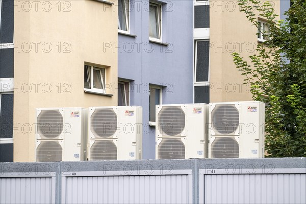 Heat pumps in a residential area, multi-family houses are supplied with heating, cooling and