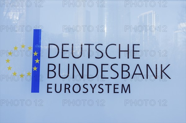DEUTSCHE BUNDESBANK EUROSYSTEM logo on a glass surface featuring European stars and blue stripe,