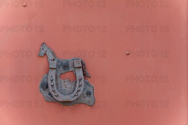 Horseshoe as a lucky charm on a metal farm gate, lucky symbol, Palatinate, Rhineland-Palatinate,