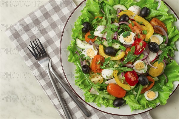 Vegetable salad, with quail eggs and olives, fresh, close-up, no people