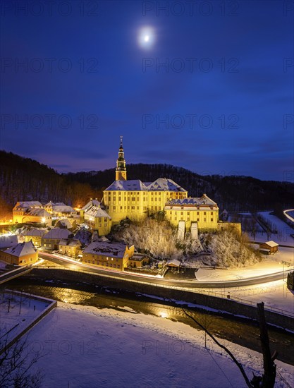 Winter evening in the Müglitz valley, impressively illuminated Weesenstein Castle at the blue hour,
