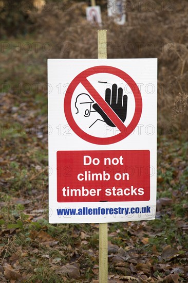 Forestry tree felling signs on Upper Hollesley Common, Suffolk, England, UK, Do not climb on timber