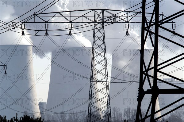 Steam rises from the cooling towers of the Vattenfall power plant in Jänschwalde, power lines and