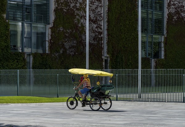 Tourists on bicycles, fence at the Federal Chancellery, Berlin, Germany, Europe