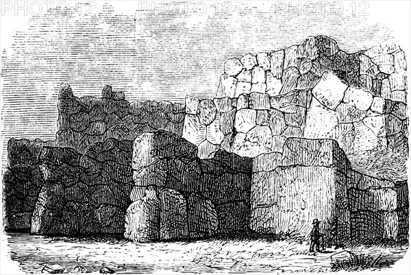 Peruvian city wall Sacsayhuamán in Cusco, Inca complex of stone walls, rocks, person, size
