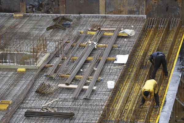 Construction site, reinforced concrete reinforcement bars, for a building ceiling, are installed