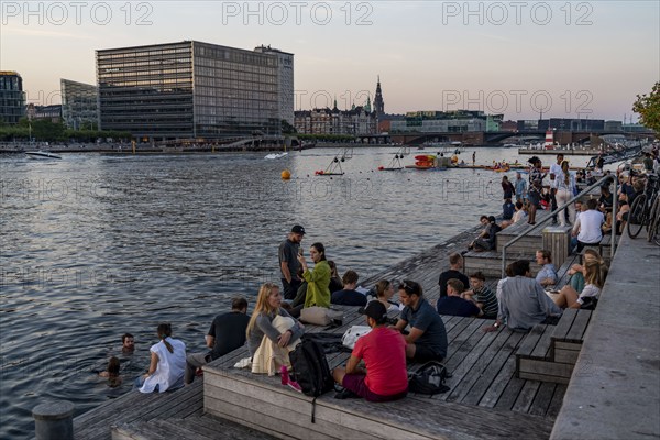 Summer evening in Copenhagen, at the harbour, Islands Brygge, people celebrating, eating, drinking,