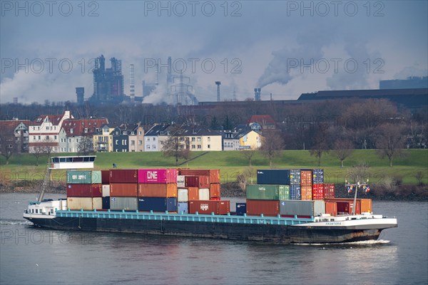 The river Rhine near Duisburg, houses on the Rhine dyke, Laar district, Thyssenkrupp Steel