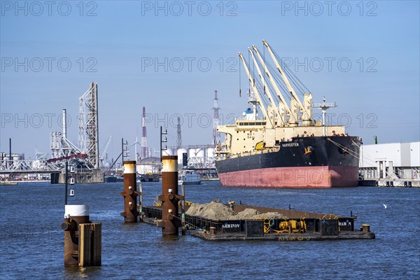 The port of Antwerp, on the Scheldt, is the second largest seaport in Europe, freighter harvester